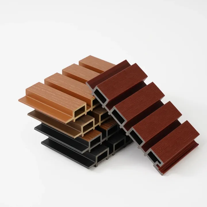 Fluted WPC wall panel samples in several wood-grain colors